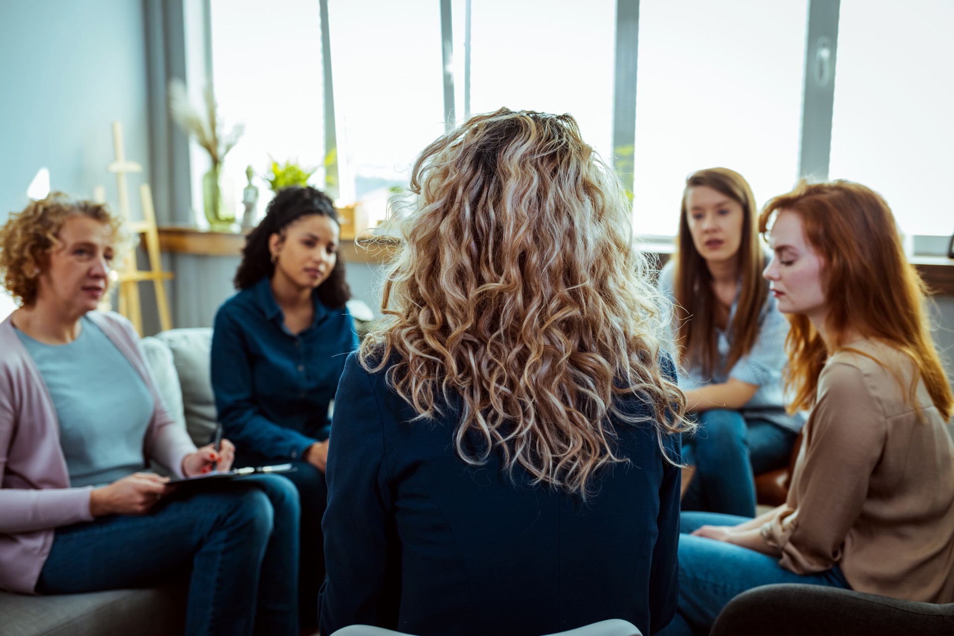 Psychologist talking to group of people